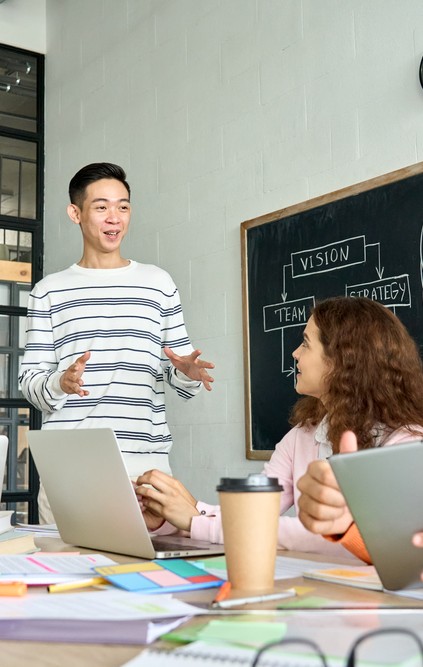 Boy taking to fellow Students